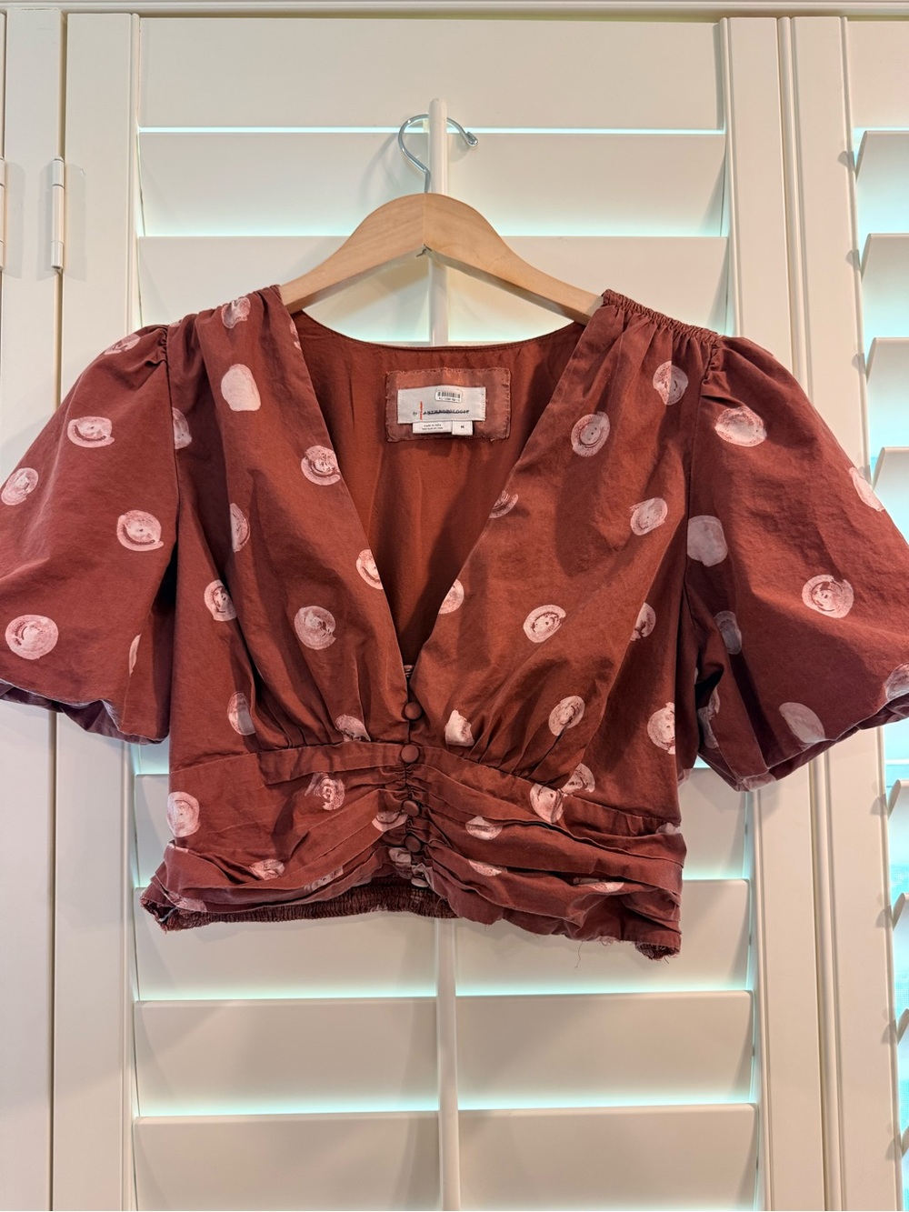 Anthropologie rust brown cropped blouse with white dot print